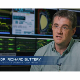 The director of DIII-D, Richard Buttery, sits in front of monitors in the control room